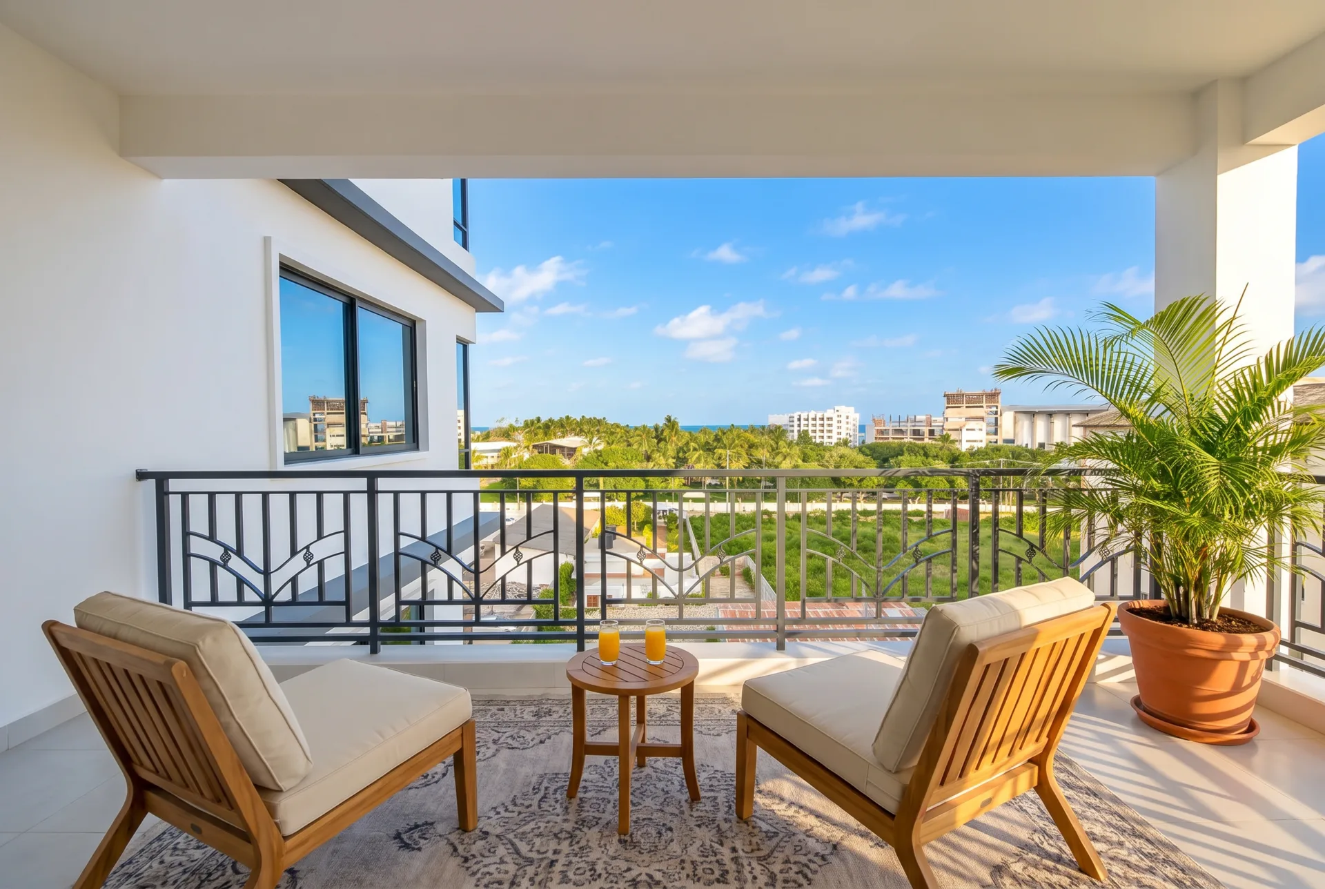 The balcony with lounge chairs and the ocean view