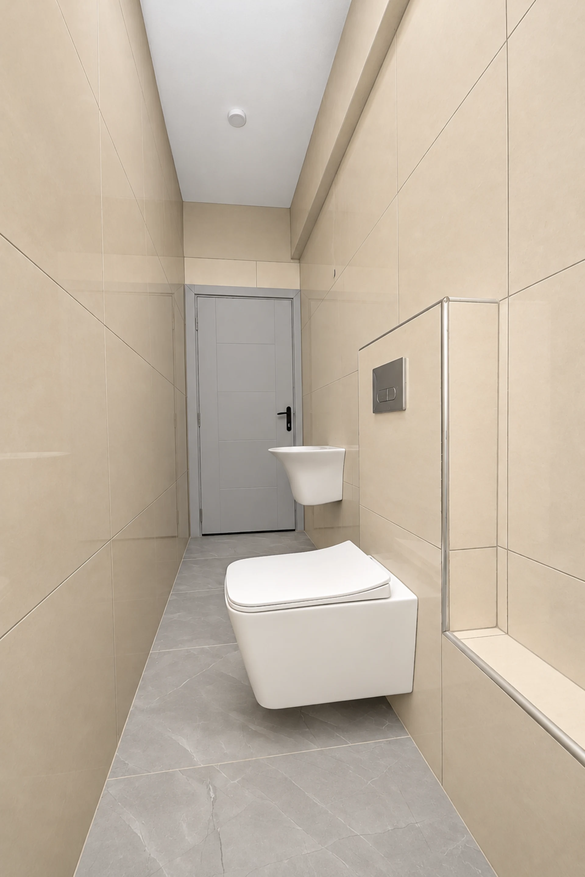 A bathroom with a wall-hung WC and tiled walls