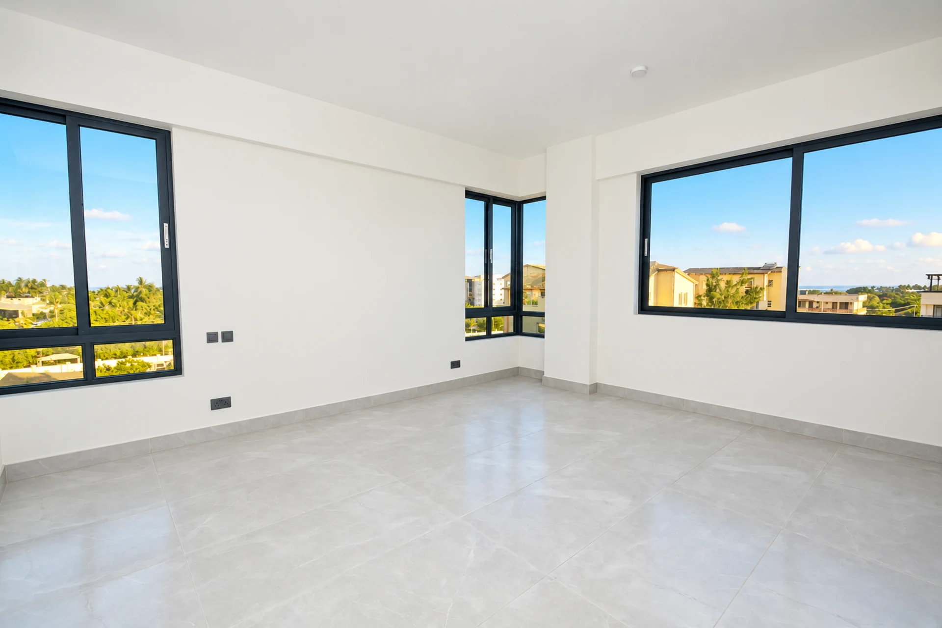 A bedroom with windows on two sides