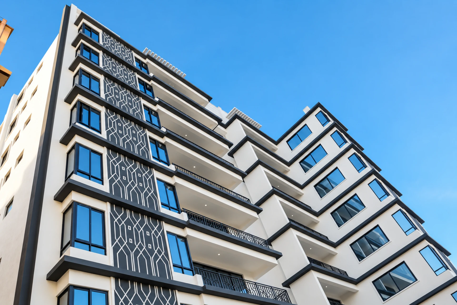 A corner of the building showing the lattice facade panels